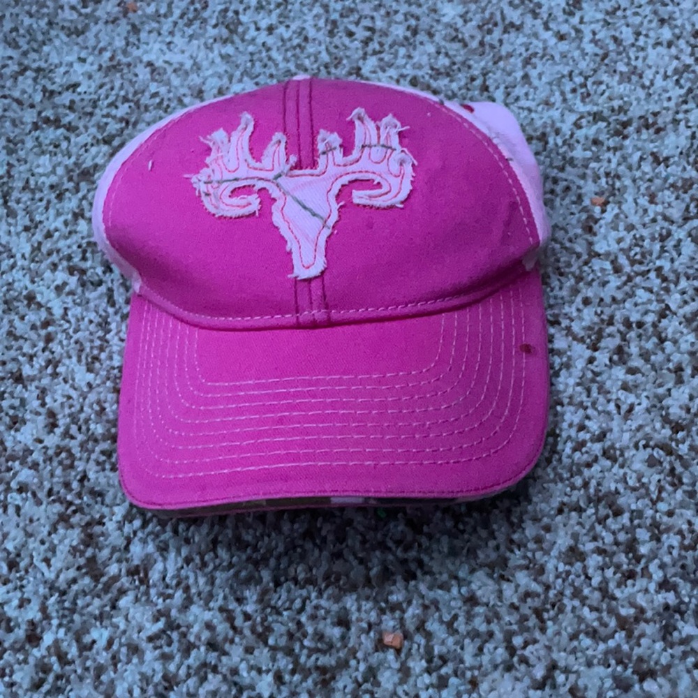 Dark and light pink buck wear hat